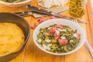 Southern-Style Collard Greens with Ham Hocks. Shredded collards cooked in a rich ham hock stock with touch of honey. Served with fresh sweet onions and hot pepper sauce along with a side of hot water cornbread.