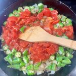 okra and tomatoes in a skillet