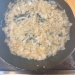 onions cooking in bacon grease