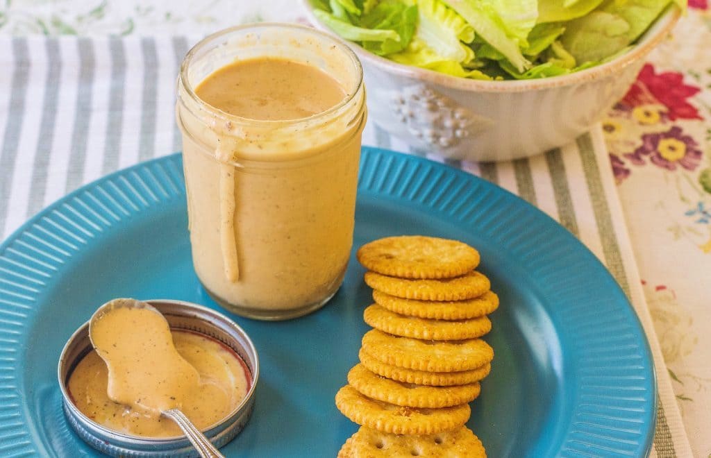 Comeback Sauce in a jar with crackers on a plate