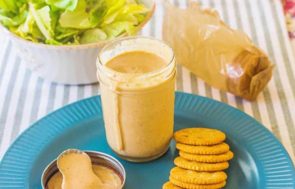 Comeback Sauce in a jar with crackers on a plate