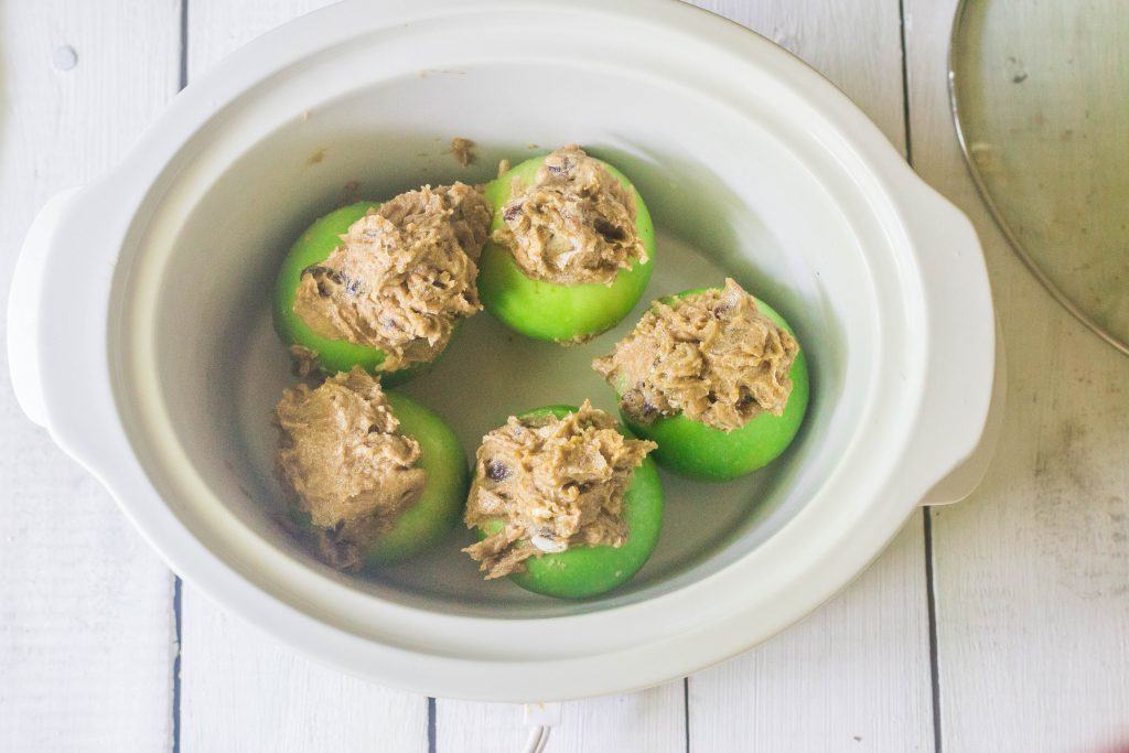 Slow-Cooker Girl Scout Apples. Granny Smith apples, cored and filled with a mixture of butter, brown sugar, raisins and cinnamon and cooked in a slow cooker.A version of baked apples I learned in Girl Scouts.