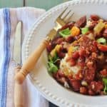 Alabama-style Slow Cooker Red Beans and Rice. Red beans and Conecuh sausage simmer with vegetables in a slow cooker.