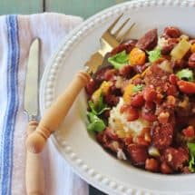 Alabama-style Slow Cooker Red Beans and Rice. Red beans and Conecuh sausage simmer with vegetables in a slow cooker.