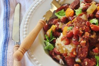 Alabama-style Slow Cooker Red Beans and Rice. Red beans and Conecuh sausage simmer with vegetables in a slow cooker.