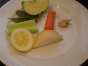 Part of the veggies and fruit on plate.