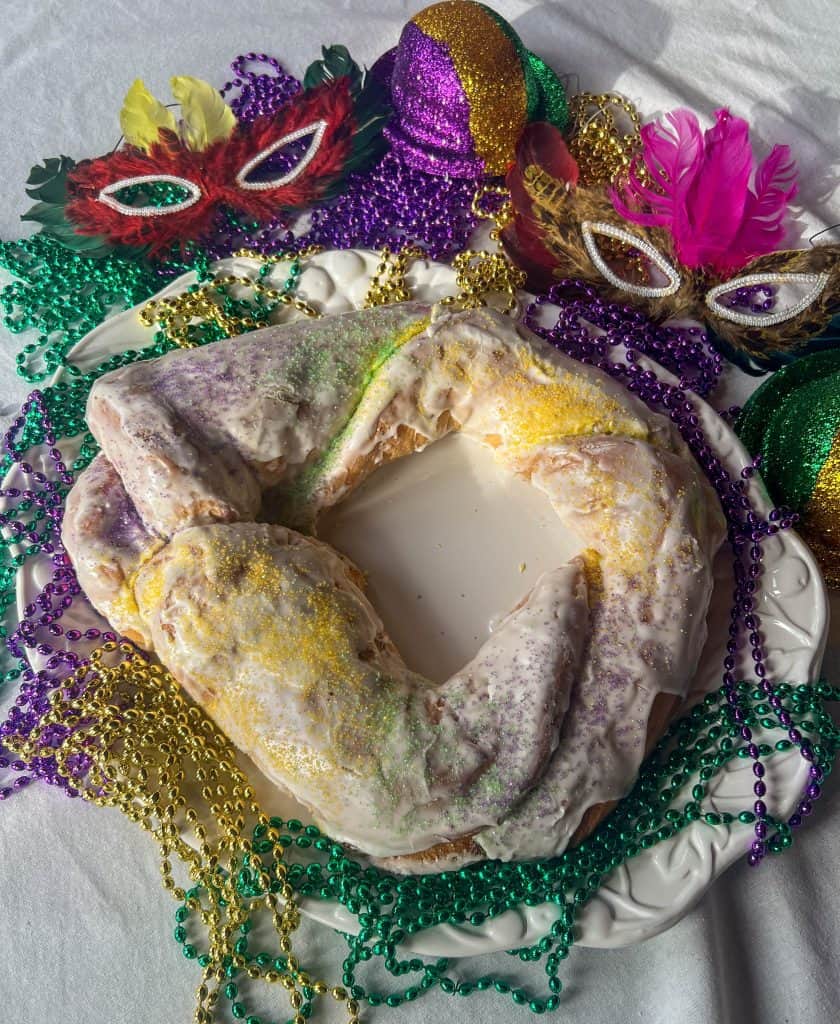 King Cake with colored sprinkles.