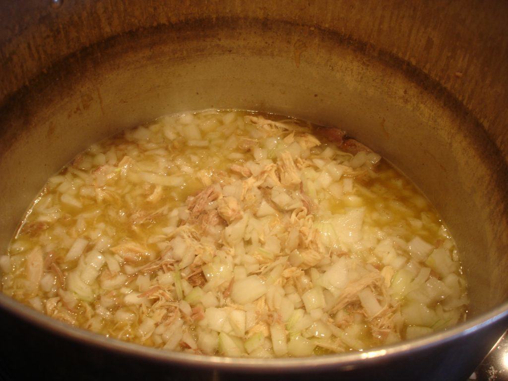 Chicken, pork and onions stewing