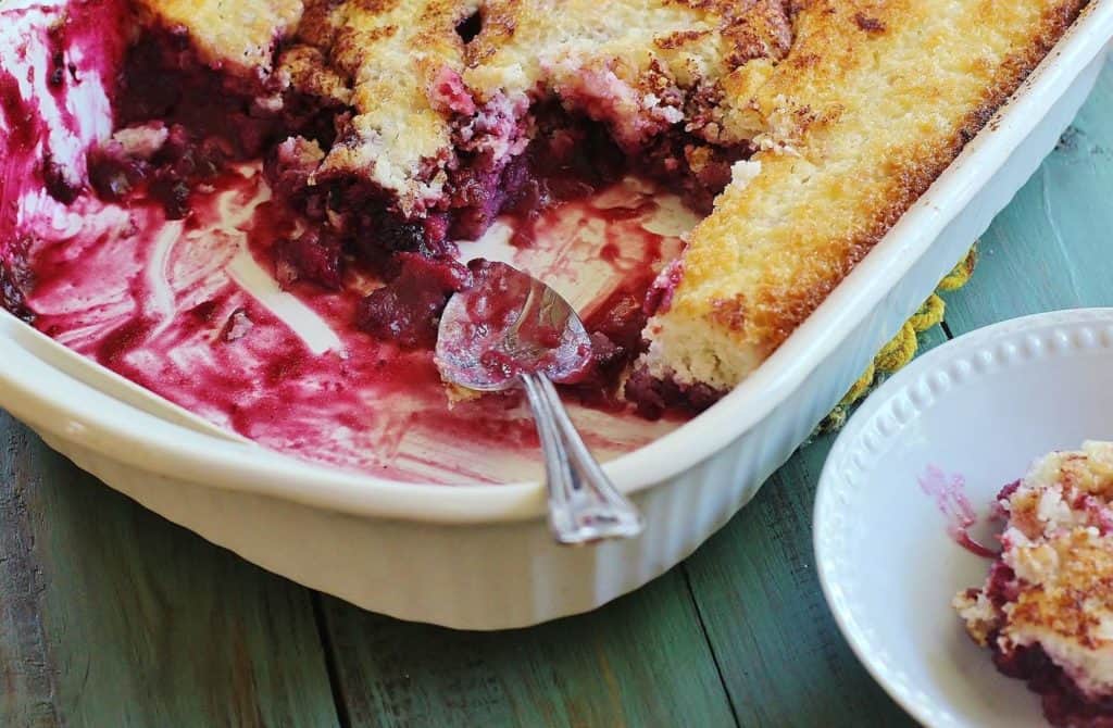 Southern Blackberry Cobbler. An iconic Southern dessert. Blackberries are gently stewed and pour over a three ingredient, biscuit like topping. 