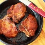 pork chops in a cast iron skillet