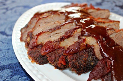 Beef Brisket. Smothered in a tomato-y BBQ sauce and bacon, cook low and slow in the oven. #bbq #barbecue #beef #brisket #southernfood #southern