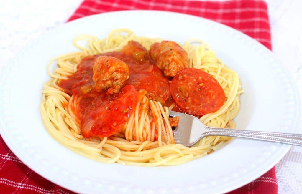 Extra Meaty Spaghetti. Ground beef, pepperoni and Italian sausage with loads of vegetables, herbs and spices make a hardy sauce. #spaghetti #sauce #tomato #beef #pepperoni #Italian sausage