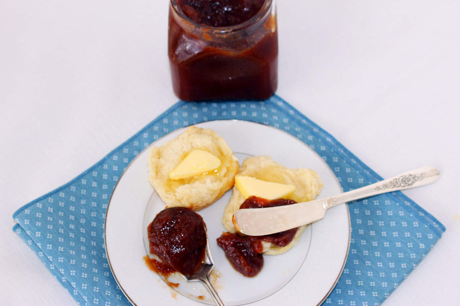 apple butter on a buttered biscuit
