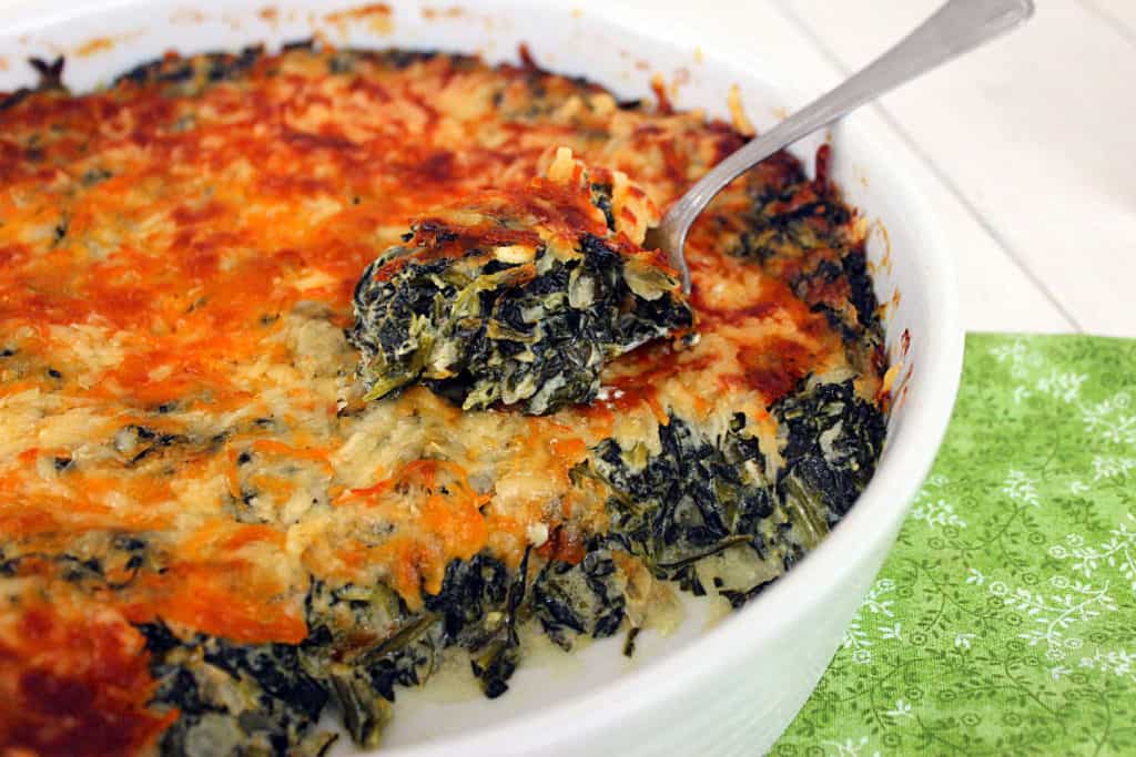 Cheesy Creamed Spinach Casserole in baking dish.