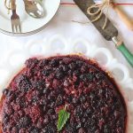 Triple Berry Upside Down Cake. A cake baked in a cast iron skillet containing a triple berry caramel topping.