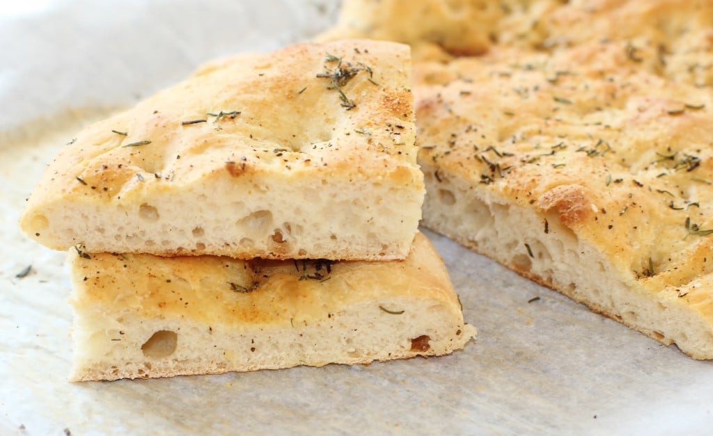 Garlic and Herb Focaccia Bread. Make quick work of this bread by starting off with a frozen loaf of prepared dough. #garlic #herb #focaccia #bread