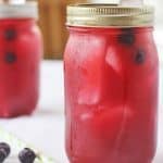 Blueberry Lemonade in a canning jar with ice.