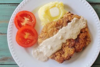 Country Fried Steak with Gravy. Seasoned breaded cube steak fried and served with homemade gravy.