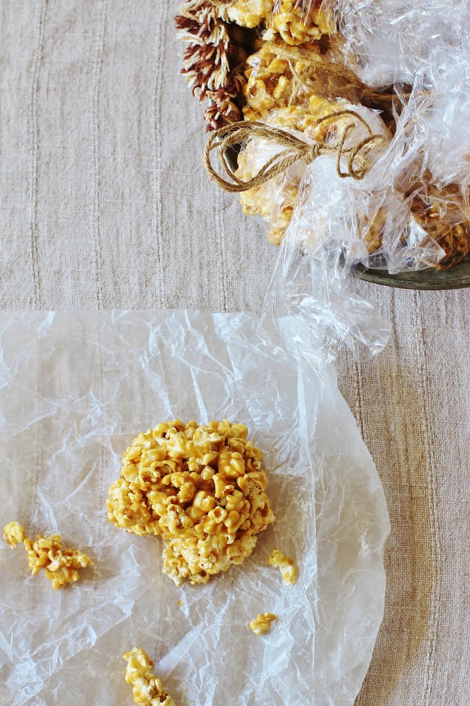 Old Fashioned Popcorn Balls. Freshly popped popcorn coated with a homemade butterscotch-y candy coating.