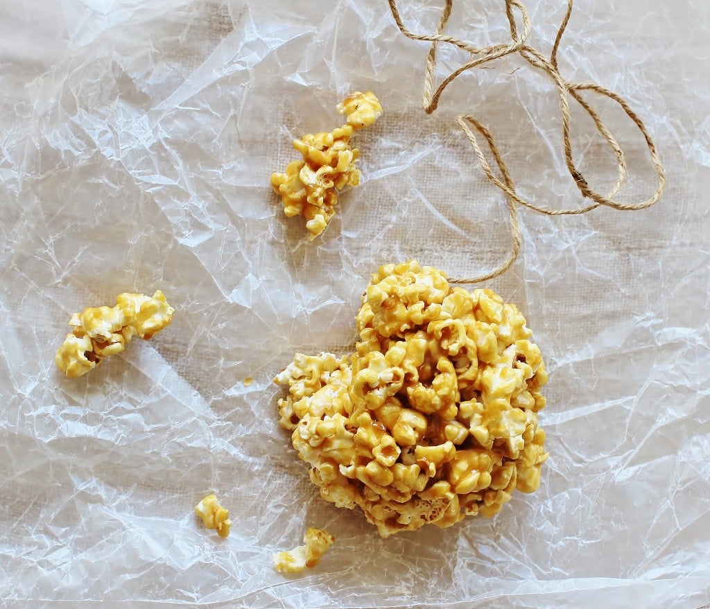 Old Fashioned Popcorn Balls. Freshly popped popcorn coated with a homemade butterscotch-y candy coating.