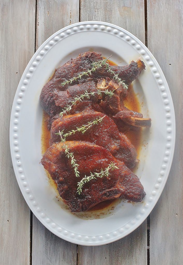 Slow cooker Brown Sugar Pork Chops on plate.