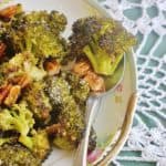 roasted broccoli and pecans on a platter