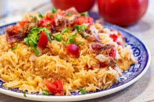tomatoes and rice on a plate
