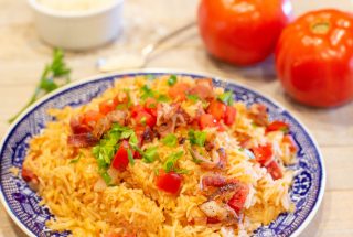 tomatoes and rice on a blue plate