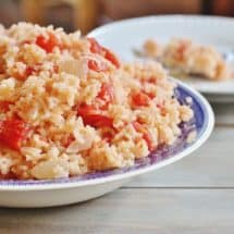 Tomatoes and Rice. Onions cooked in bacon grease and combined with tomatoes and rice.