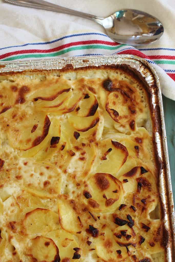 Buttermilk Scalloped Potatoes. Thinly sliced Yukon gold potatoes baked in a white sauce made with buttermilk, sweet onions and garlic.