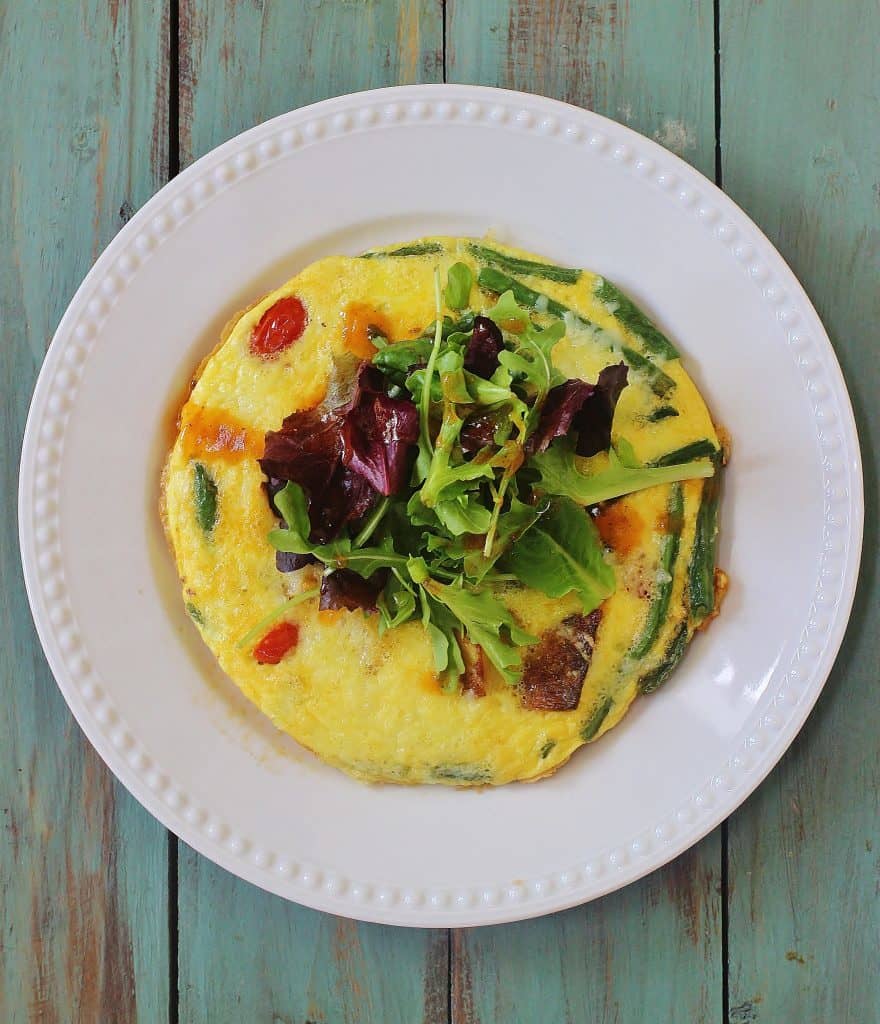 Garden Vegetable Frittata. Use leftover or fresh vegetables and top with salad greens for a vegetable heavy meal. a great "clean out your refrigerator" option.