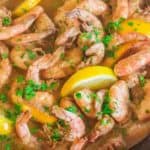 shrimp in a cast iron skillet in buttery broth