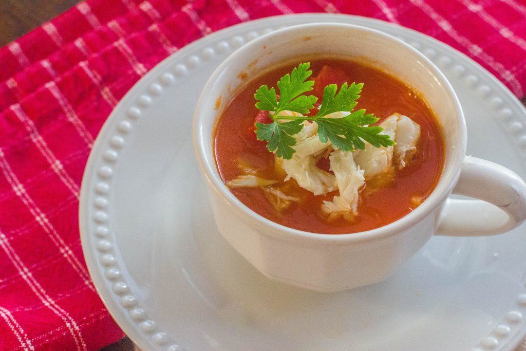 Roasted Red Pepper Tomato Soup with Crab. A twist on a childhood favorite, tomato soup gets updated with the addition of roasted red pepper and a dollop of lump crab meat.