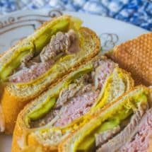 Authentic Cuban Sandwich Ybor City-style. Cuban bread, mustard, dill pickles, ham, pork and Swiss cheese create this iconic sandwich.