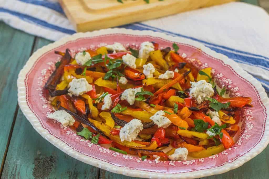 Simple Roasted Sweet Peppers with Herbed Goat Cheese. Colorful and delicious sweet peppers roasted and served with a sprinkling of herbed goat cheese. #freshfromflorida #ad