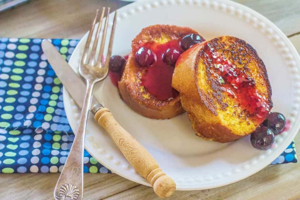 Overnight French Toast with Fresh Blueberry Orange Syrup. French bread slices soaked in custard, remain in refrigerator overnight. In the morning, cook the French bread slices and make easy Blueberry Orange Sauce.