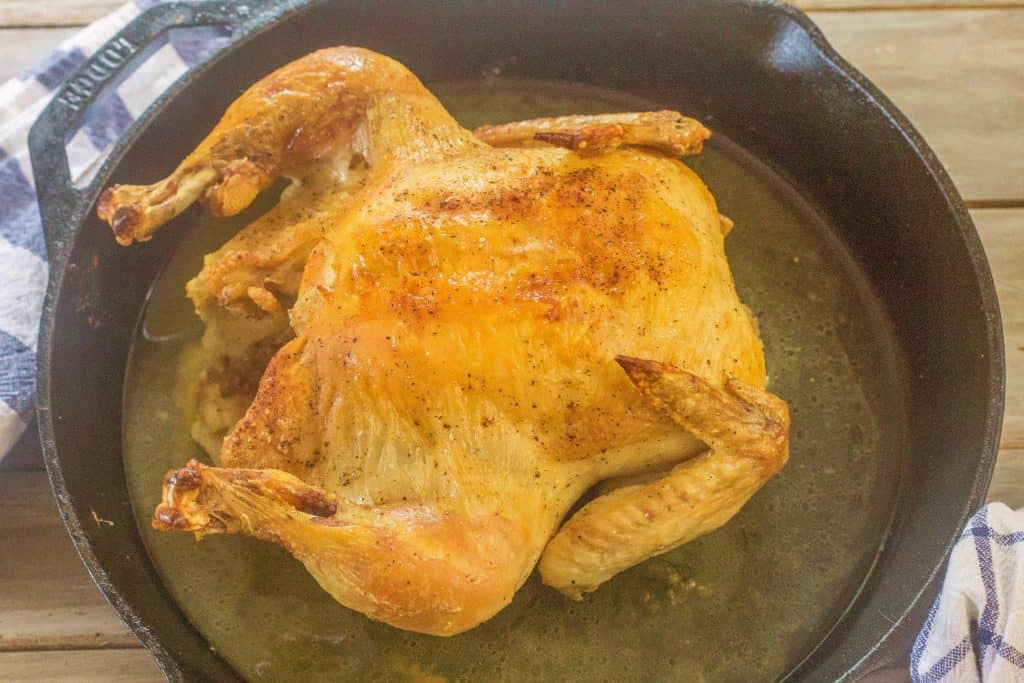 Whole Roasted Chicken is a dish that everyone who cooks chicken needs in their stable of dishes they've perfected. It's roasted simply in a cast iron skillet with a seasoning mix and melted butter.