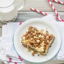 Gingerbread Magic Cookie Bars is a variation of the original Magic Cookie Bars from Eagle Brand Sweetened Condensed Milk.  Gingersnap cookies and orange juice form a  crust that's reminiscent of gingerbread cake. The layers of coconut, white chocolate, cinnamon chips, and toffee chips add a delightful spin to the classic recipe.