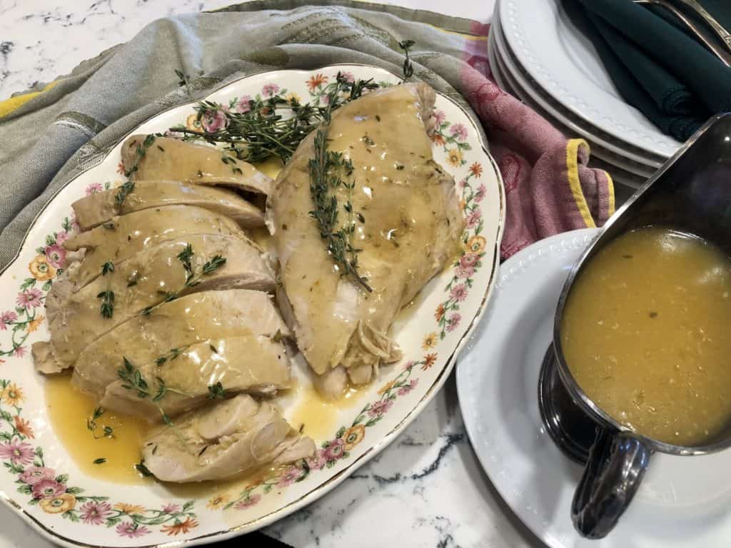 Turkey breast with gravy on a platter