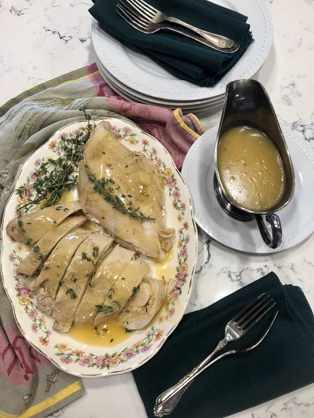 Slow-Cooker Turkey Breast with Gravy. Bone-in, skin-on turkey breast seasoned with flavored butter, cooked in a slow-cooker on a bed of fresh fruit, vegetables, herbs, and white wine. The flavorful cooking stock is thickened for gravy.