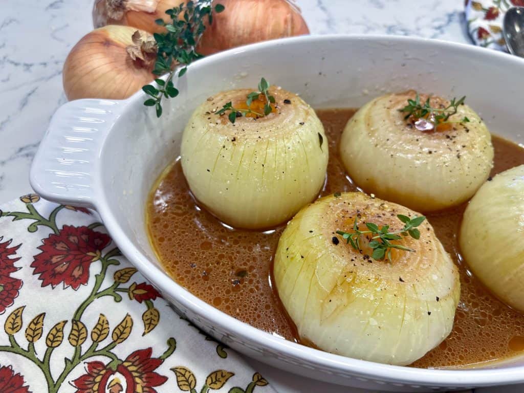 baked sweet onions in a casserole dish