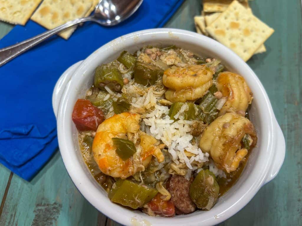 a bowl of shrimp and crab gumbo with rice