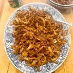 Cajun Crispy Fried Onions on a serving platter