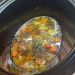 chicken bone broth in a slow cooker