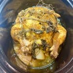 cooked whole chicken in a slow cooker