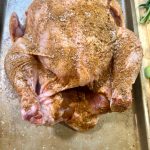 whole chicken coated with spice rub